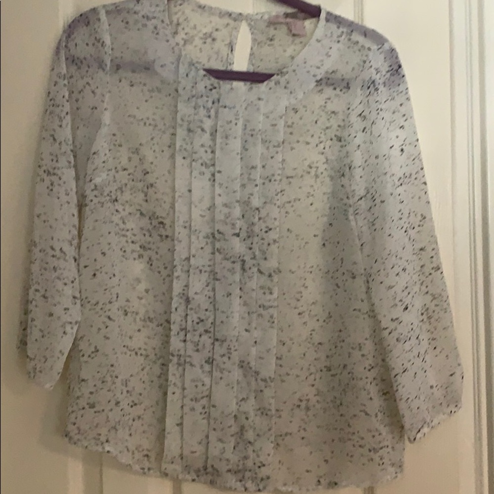 White and black speckled blouse